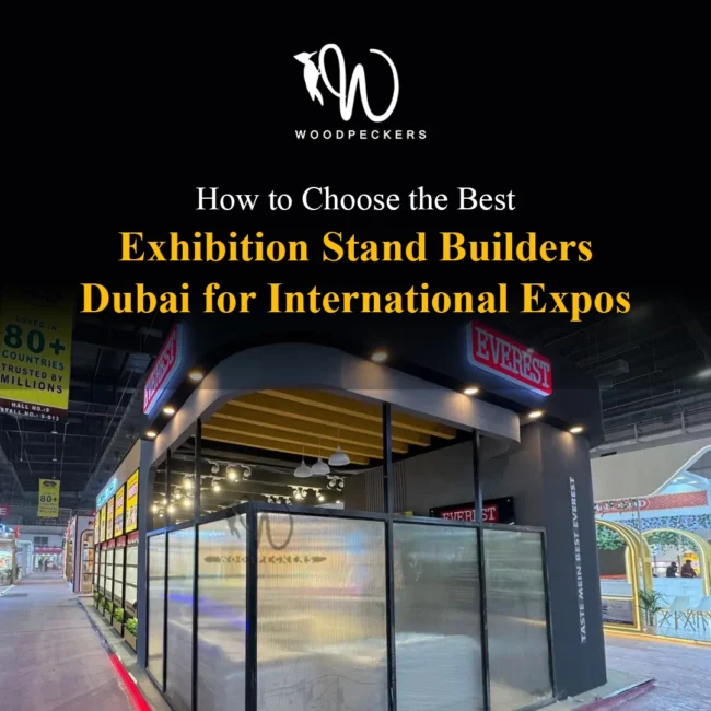 Best Exhibition Stand Builders Dubai – Everest Pavilion by Woodpeckers Custom modern exhibition booth for Everest built by Woodpeckers, featuring illuminated 3D signage, fluted translucent partitions, and architectural ceiling rafters for international expos.