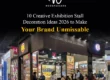 Modern exhibition stall decoration designed by Woodpeckers for Anil & Company, featuring overhead canopy lighting, illuminated 3D logos, custom FMCG display shelving, and an open layout with visitor meeting tables.