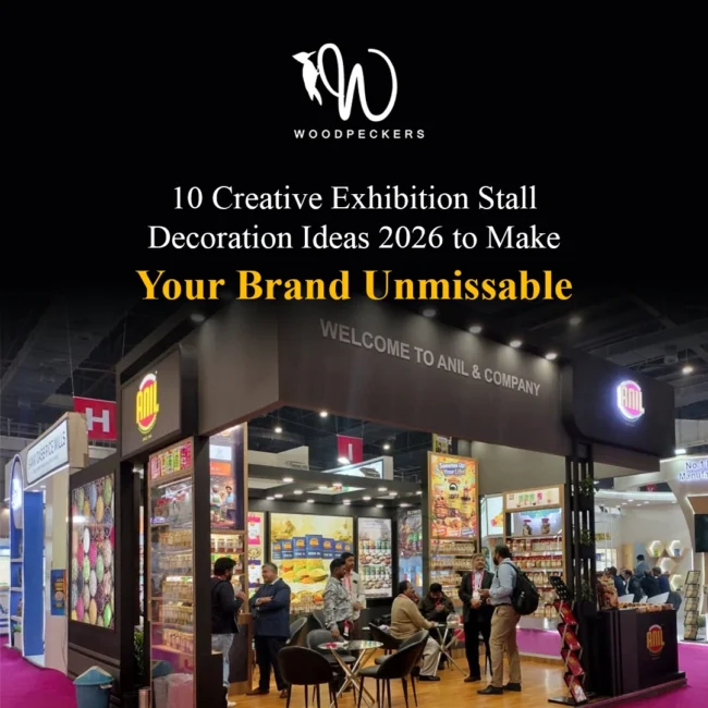 Creative Exhibition Stall Decoration Ideas 2026 – Anil & Company Trade Show Booth by Woodpeckers Modern exhibition stall decoration designed by Woodpeckers for Anil & Company, featuring overhead canopy lighting, illuminated 3D logos, custom FMCG display shelving, and an open layout with visitor meeting tables.