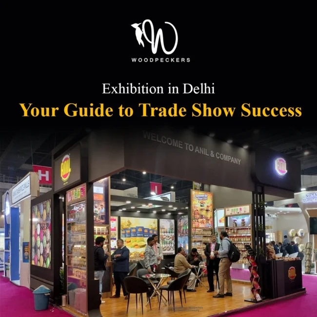 Exhibition booth fabricated by Woodpeckers for Anil & Company at a trade show in Delhi, featuring overhead spotlights, product display racks, and B2B discussion tables.