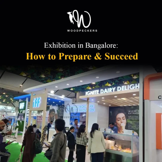 Custom exhibition stall built by Woodpeckers for IFF at a Bangalore trade show, showcasing lit signage, dairy sample tasting counters, and active visitor traffic.