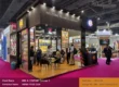 Modern 6x6 meter trade show booth designed by Woodpeckers for Anil & Company at Indus Food exhibition in Delhi featuring product displays and meeting areas.