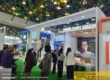 Modern custom exhibition stall designed by Woodpeckers for IFF at a dairy industry trade expo in Bangalore with active visitors and product display counters.