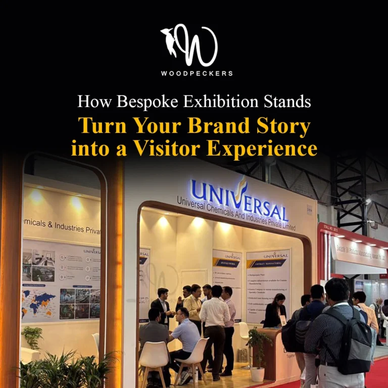 Bespoke exhibition stand built by Woodpeckers for Universal Chemicals, featuring custom brand signage, warm lighting, and attendees networking inside the booth.
